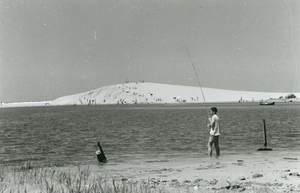Sand dunes, sun bathers and fishing at Lake Illawarra Entrance