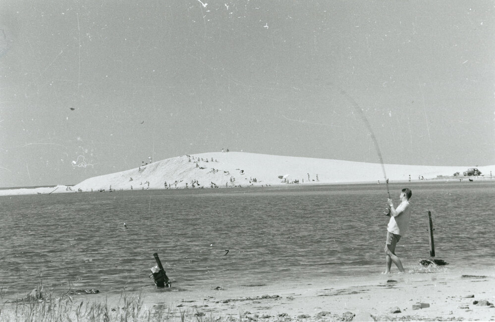 Sand dunes, sun bathers and fishing at Lake Illawarra Entrance