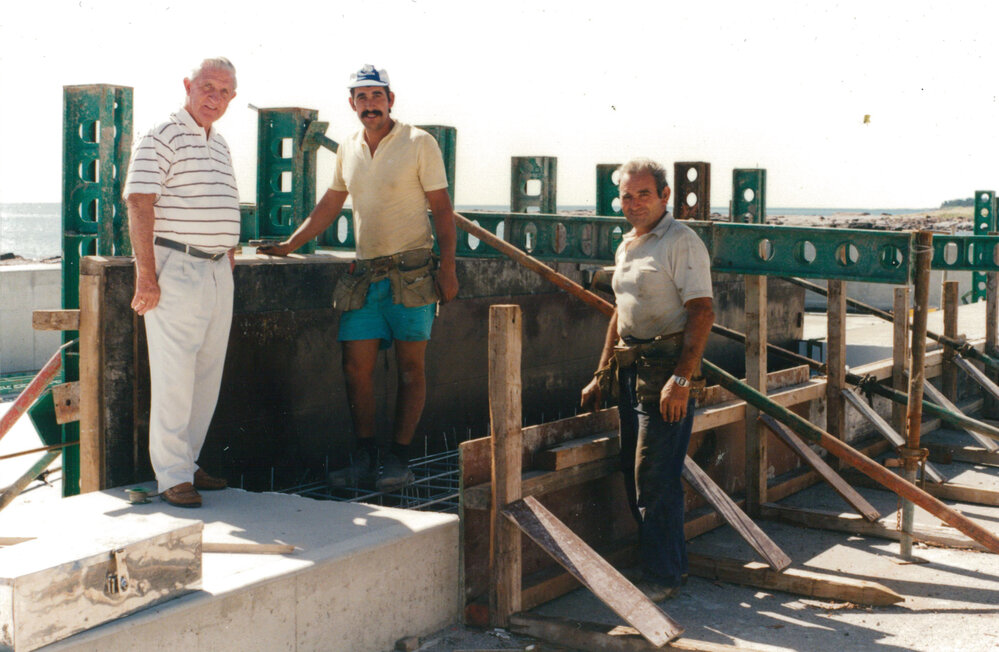 Keith Hockey with workers at Shellharbour Pool