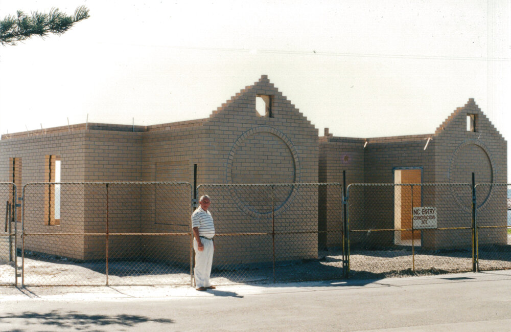 Keith Hockey beside the Shellharbour Pool amenities block