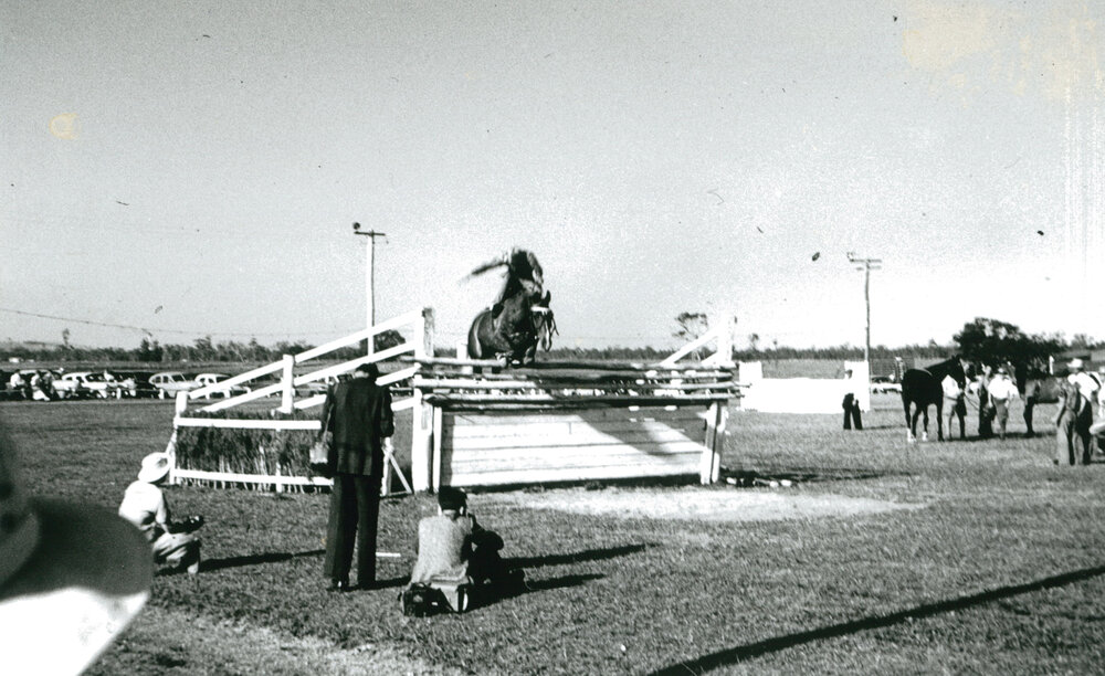 Sister Fitzgerald competing in the highjump at Albion Park Show 1957