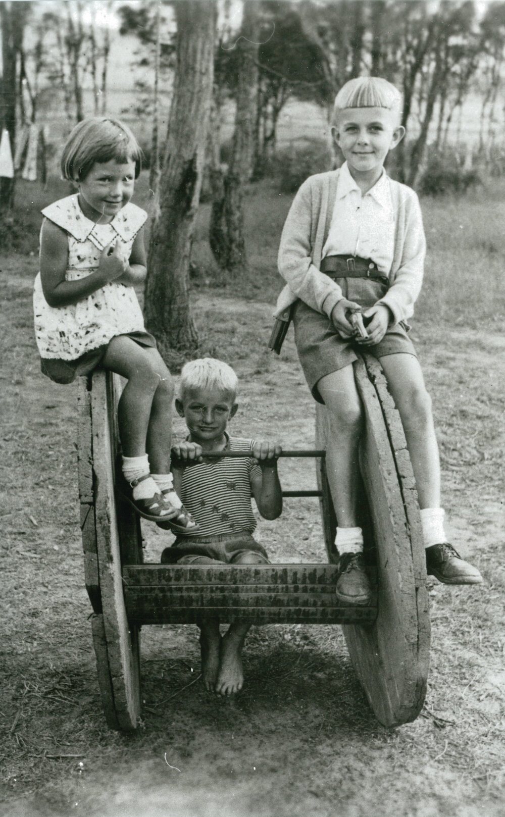 Children playing on an electrical cable reel at Oak Flats