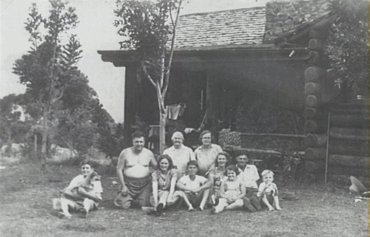 The Price &amp; Sawtell families outside Ted Price's log cabin built in 1938 near 'Nurrewin', Macquarie Pass