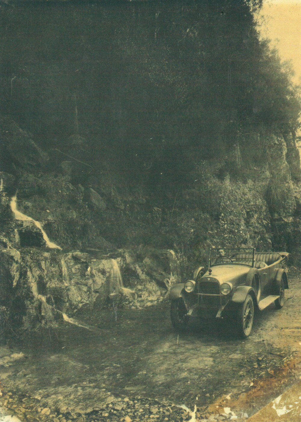 WG Harris in a 1923 Hudson passenger car at the waterfall on Macquarie Pass