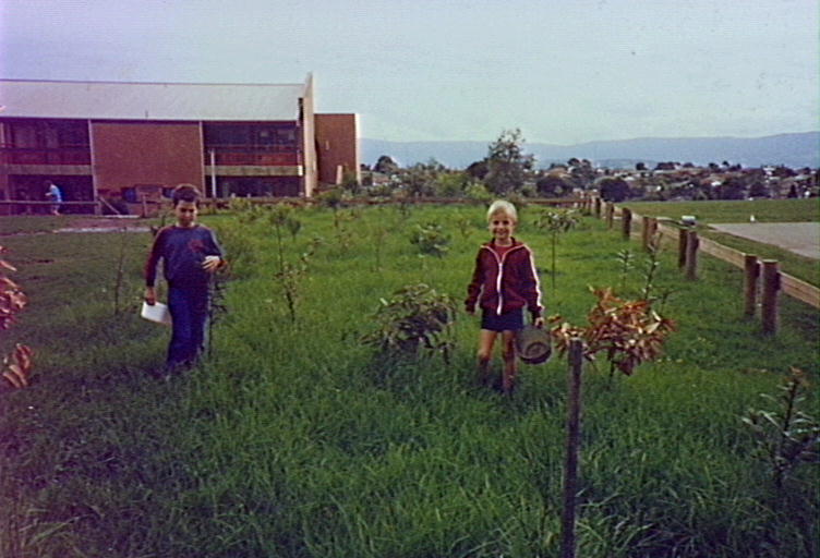 Gabriel Church and Matthew Johnston watering trees at Barrack Heights Public School