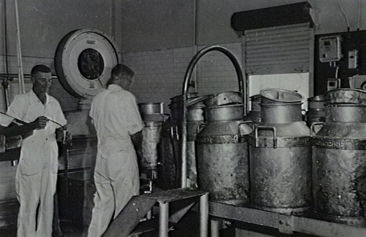 Alan Dawes &amp; Fred Sawtell weighing and sampling milk at the Illawarra Cooperative Central Dairy factory