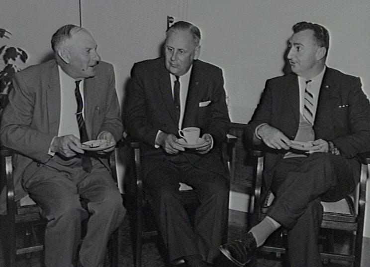 JHB McDonald (Chairman),  ST Stephens (Min for Housing &amp; Coop Societies) &amp;  RW Clay (Mayor) 