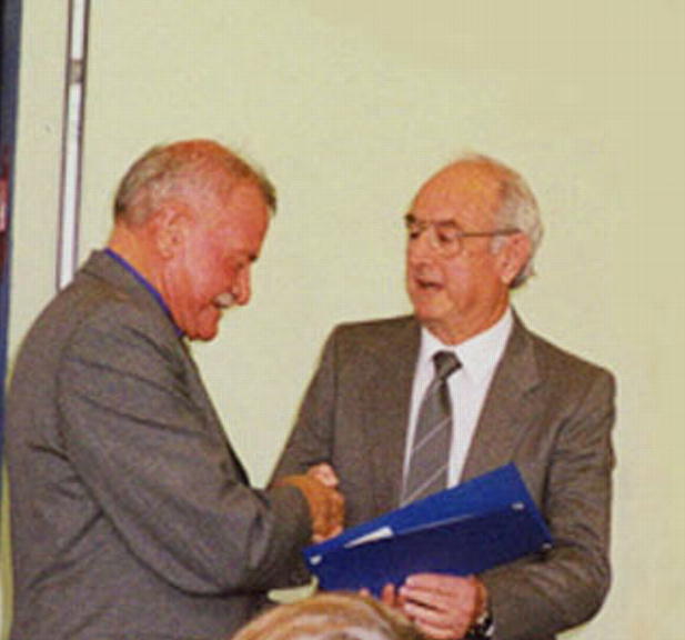Kevin Gillis receiving the International Year of Older Persons Award in 1999 from Colin Hollis MP for Throsby