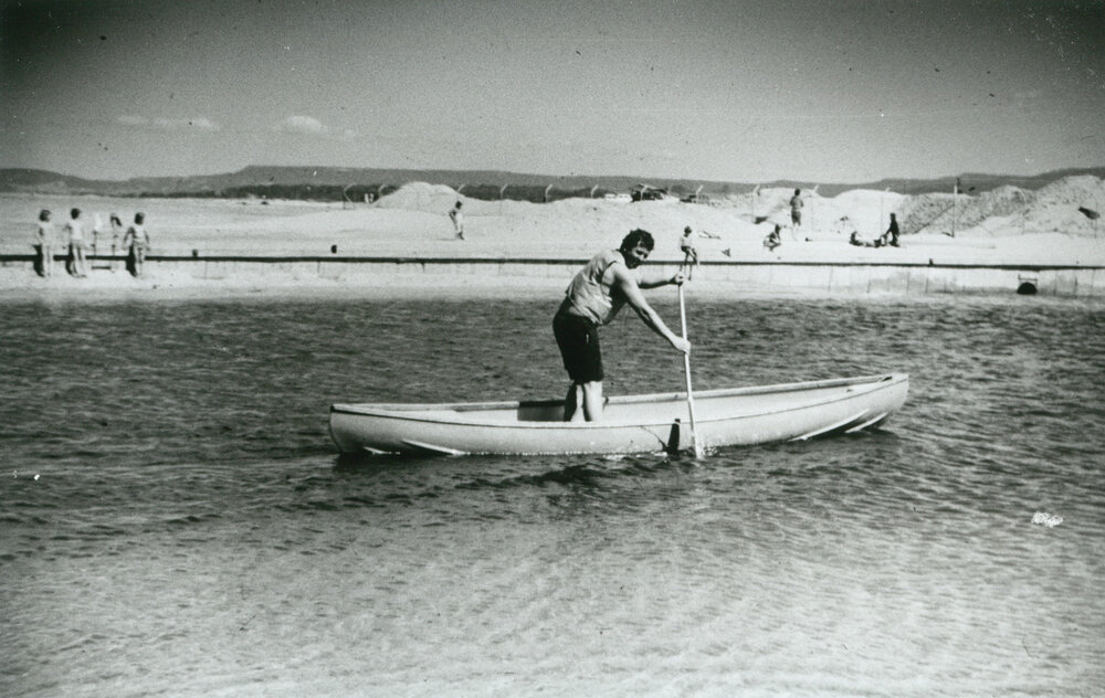 Jim Fuke in a canoe at Lake Illawarra Entrance