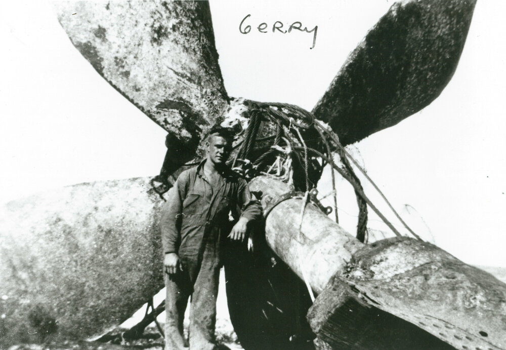 Gerry Costello beside the propeller of shipwreck 'Cities Service Boston'