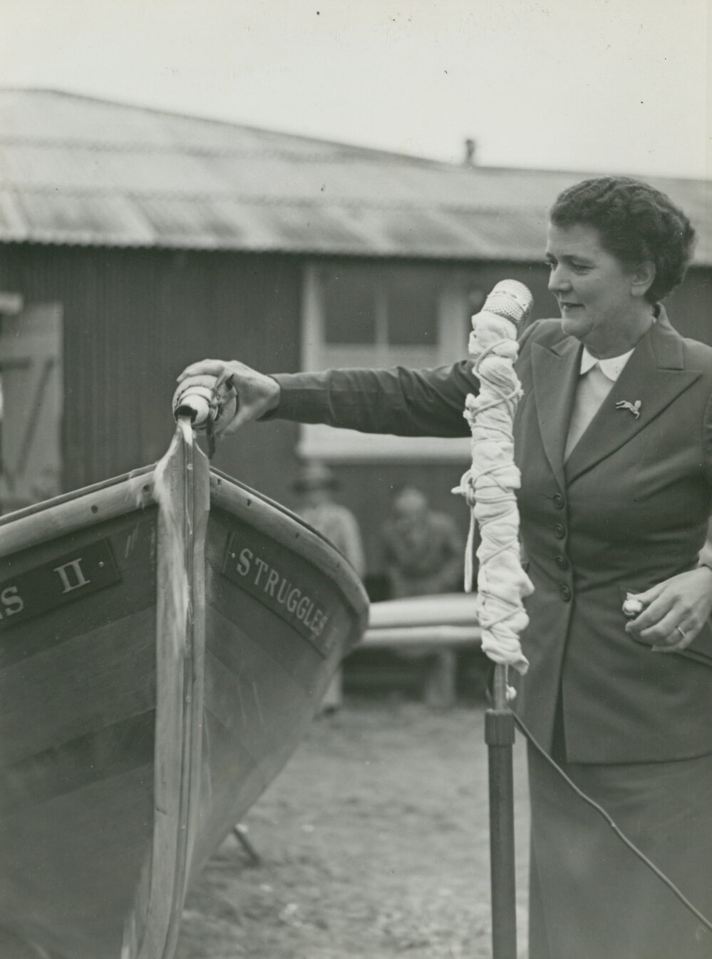 Mrs Adrian Curlewis christening Shellharbour surfboat &lsquo;Struggles 11&rsquo;