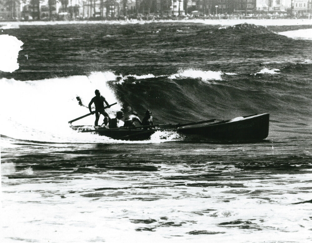 Shellharbour boat crew surfing the wave