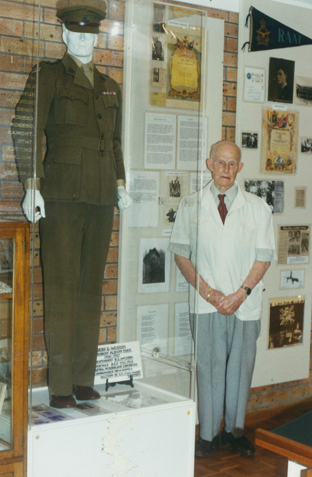 Bert Weston beside his World War 11 uniform on display at Tongarra Museum