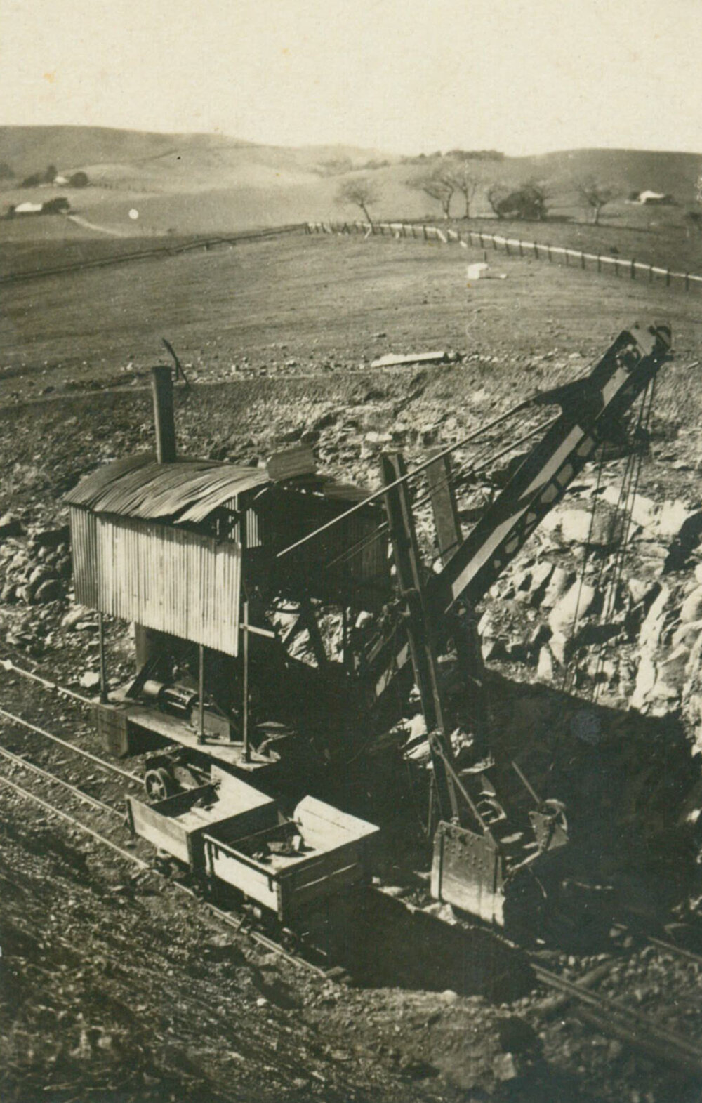 Rail crane lifting trucks back on to the line after a derailment near Dunmore