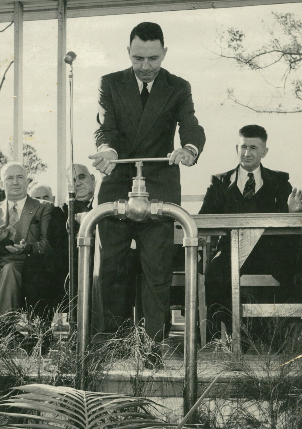 Hon JB Renshaw turning on the water supply to Albion Park and Oak Flats