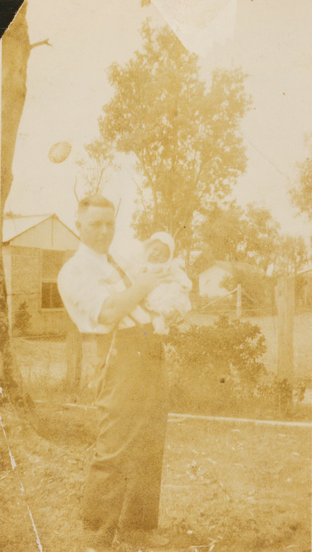 Alan Curr holding baby Carlene Pullen and Inskip's Dairy