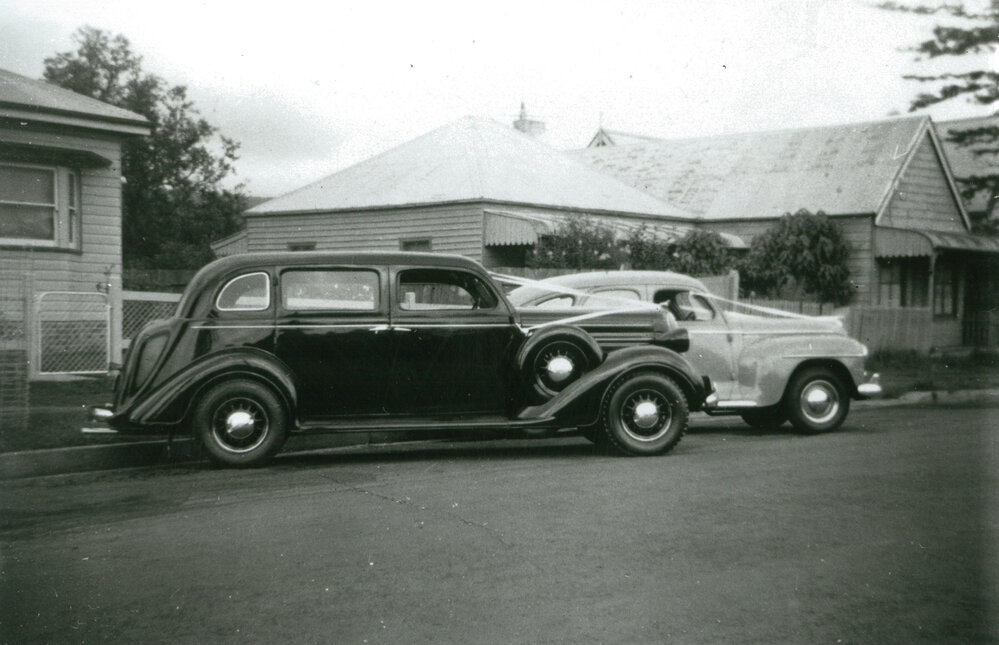 A 1936 and 1948 Dodge car belonging to W G Harris &amp; Sons