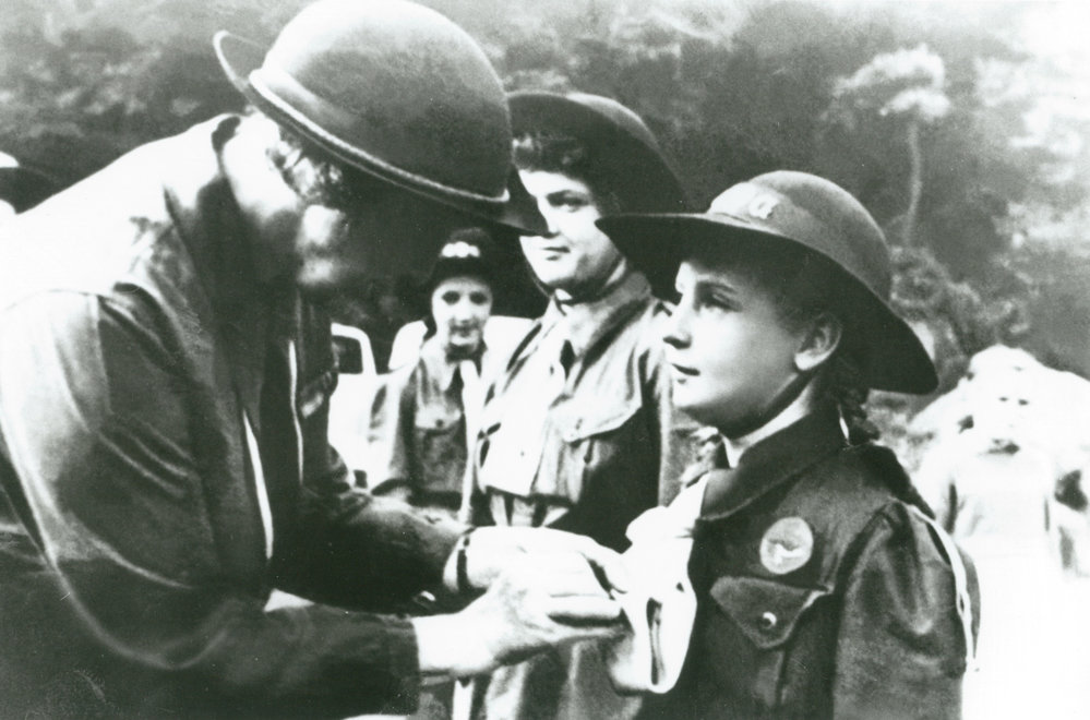 Rosemary Small receiving her Girl Guides badge from Lady Baden Powell at Mount Keira Scout Camp 1948