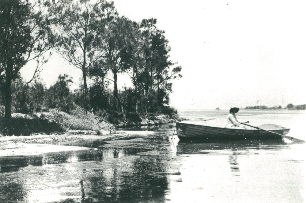 Lady and rowing boat, Lake Illawarra