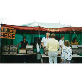 Mayor Cec Glenholmes serving juice on Australia Day