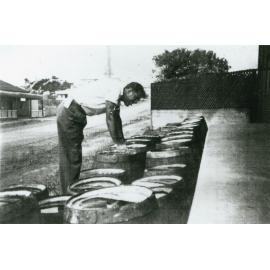 Stacking beer kegs at Ocean Beach Hotel, Shellharbour 1947