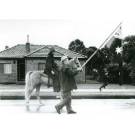 Brian Walsh with the Australian flag during Macquarie Pass Centenary Parade