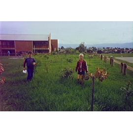 Gabriel Church and Matthew Johnston watering trees at Barrack Heights Public School
