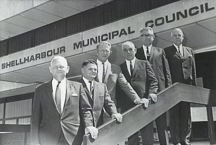 Former Mayors and Town Clerks of Shellharbour Municipal Council 1971.

L-r: Alan J Beaton (Mayor), Des King (Town clerk), Ray Hippisley (Mayor), E Stan Teggins (Town clerk), Keith G Grey (Mayor), D S Bolin (Town clerk)
